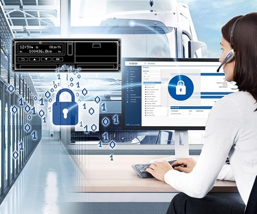 Visual image of a woman with dark hair sitting at a desk with a headset on and a computer in front of her. In the background is the silhoutte of a truck.. To her left, an illustrated tachograph is depicted as well as a blue lock with 0s and 1s.